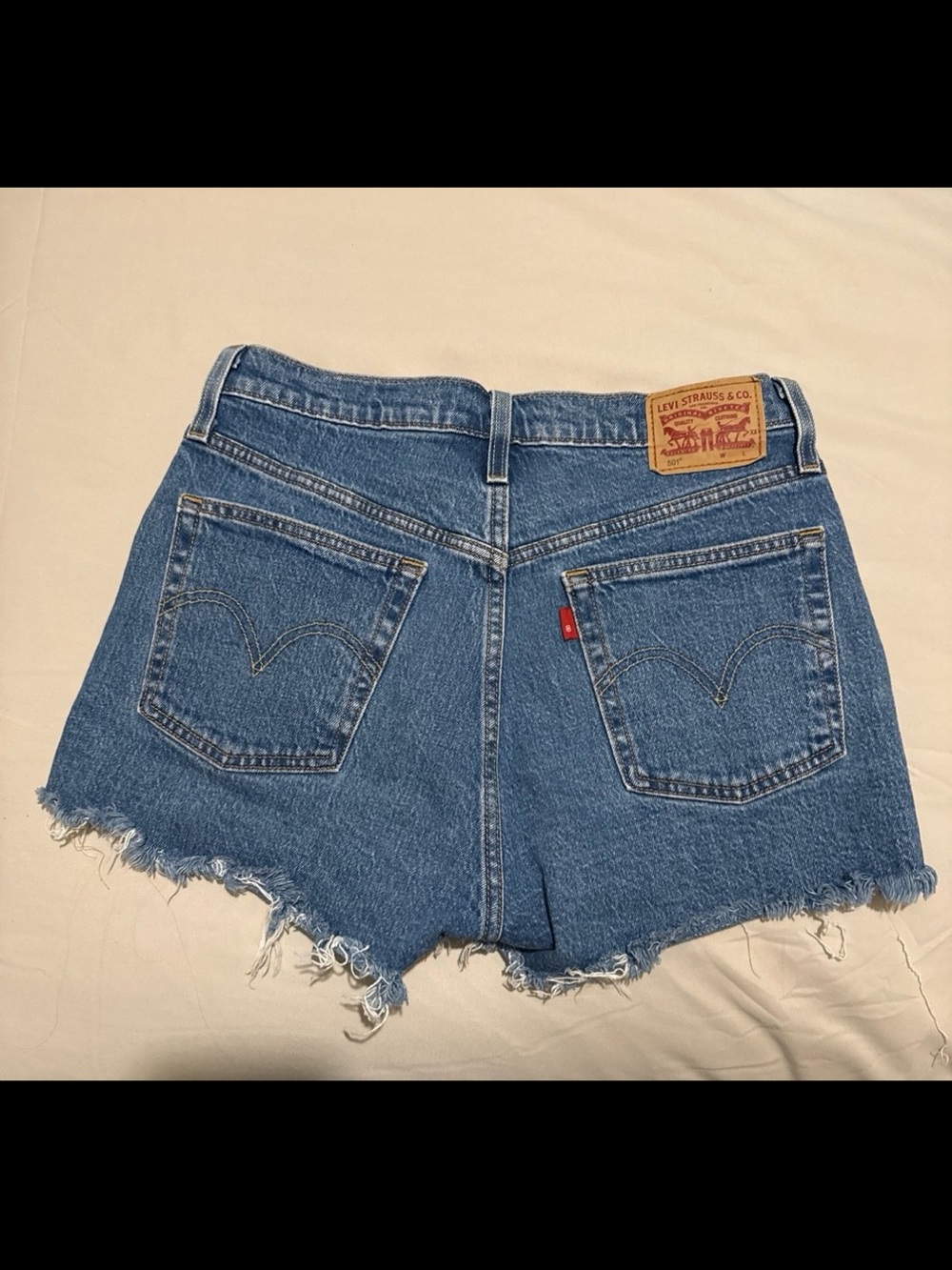 Levi's Medium Blue Denim Cutoff Shorts with Frayed Hem